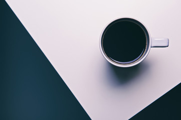 cup of coffee on a black and white geometric background