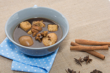 Eggs boiled stewed in the gravy on white background