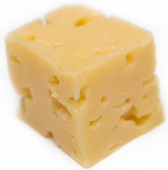Cube of cheese isolated on a white background