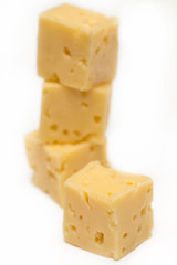 Cube of cheese isolated on a white background