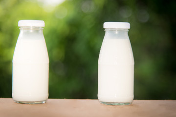 milk in glass on table.