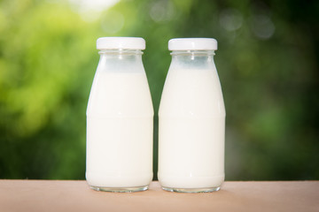 milk in glass on table.