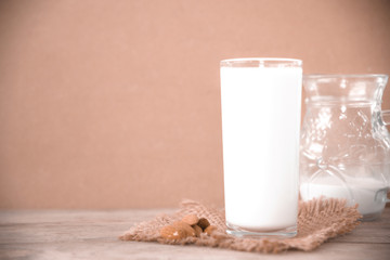 milk in glass on table.