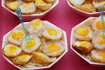 Quail eggs with sauce in street food