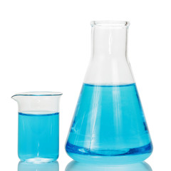 A chemical flask and beaker with blue liquids isolated on white background.