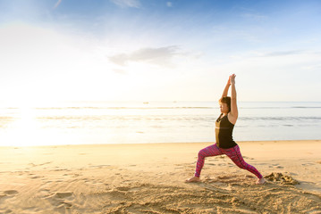 Fototapeta na wymiar Woman yoga on the beach