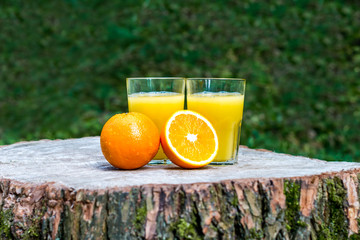 Fresh orange juice with oranges fruit outdoors