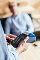 Person using payment terminal