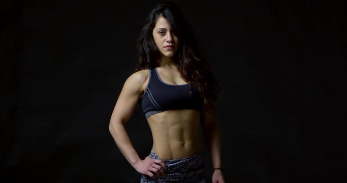 Athletic young woman walking towards the camera, into focus, shot on R3D