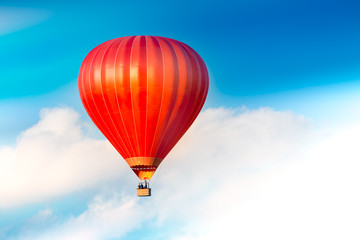 Red air balloon in the sky.