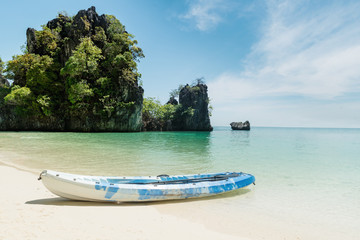 Blue kayaks on the tropical beach in Phuket, Thailand. Summer, Vacation and Travel concept.
