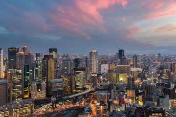 Fototapeta na wymiar Osaka downtown city skyline at the landmark Umeda District in Osaka, Japan.