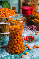 Berries of sea buckthorn with syrup