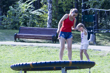 mother and daughter playing on the Playground