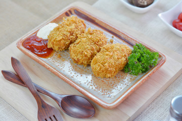 Deep fried potato with batter in square plate