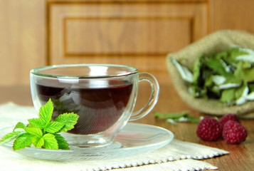 Glass cup of warm mint tea