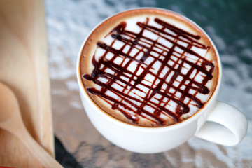 Mocha hot coffee on glass table
