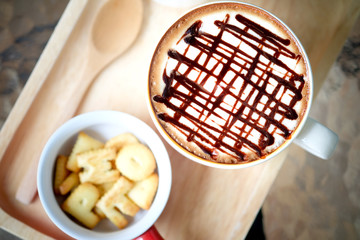 Mocha hot coffee on the wood plate