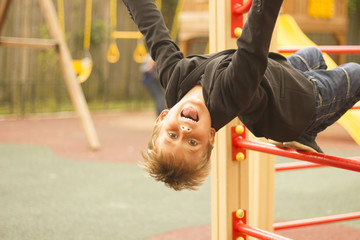 Fototapeta premium young boy playing on the Playground