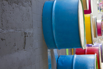 multicolored metal barrels in the wall design
