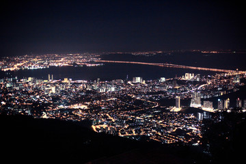 Amazing Cityscape Penang downtown at night, from the top of view on skyscraper, show lighting on the road of communication concept.