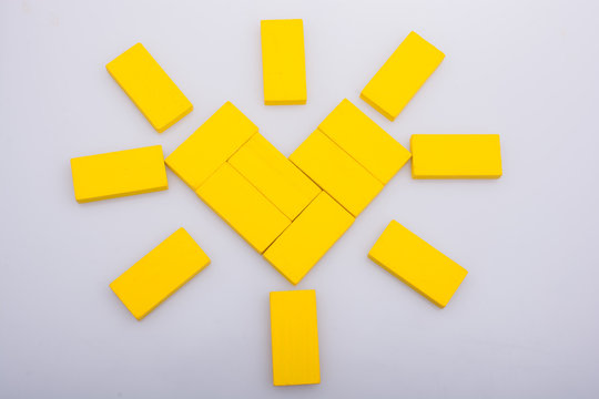 Colorful domino pices forming the  Sun shape