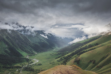 Beautiful landscape with meadow valley and clouds