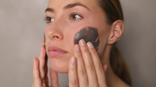 Woman applying beauty product