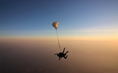 Skydiving tandem sunset with soft focus on the background