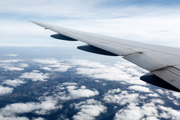 airplane wing on the blue sky background