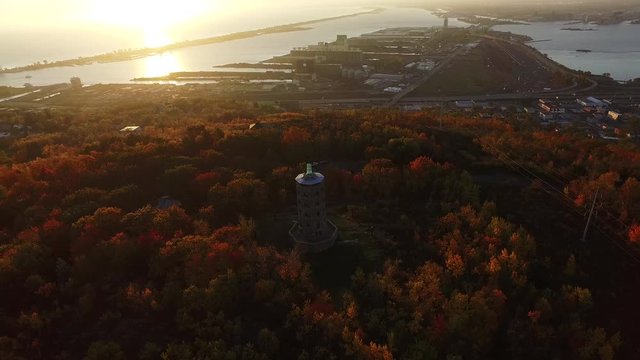 Enger Tower on scenic hillside at sunset, aerial