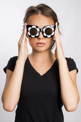 Obraz premium Beautiful woman sunglasses for summer and eye-wear concept close up