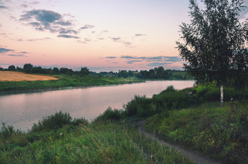 Fototapeta na wymiar Summer landscape with river.Twilight.Magical atmosphere.Fog over the water.River Krasivaya in Tula region,Russia. 
