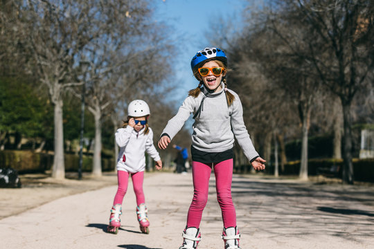 Little Girls Rollerblading in the Park