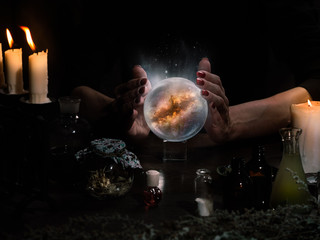 Witchcraft. The hands of witches, magic ball