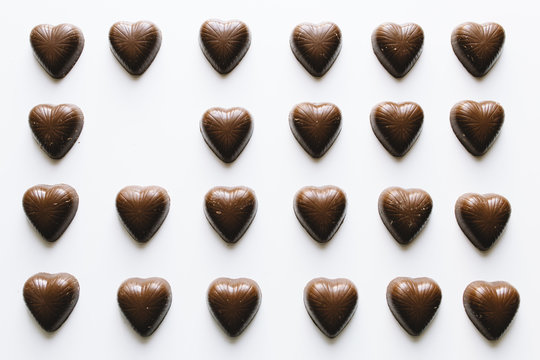 Grid Of Chocolate Hearts With One Missing