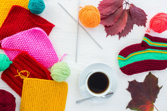 knitting with a mug of coffee
