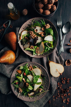 Delicious salad with pear, walnuts and hazelnuts