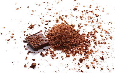 Pile chopped, milled chocolate with shavings isolated on white
