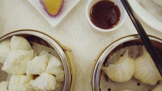 Smooth panning video of Chinese Yum cha with Dim Sum and tea