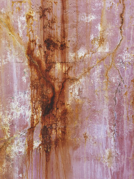 Close up of dripping paint and rust on building wall