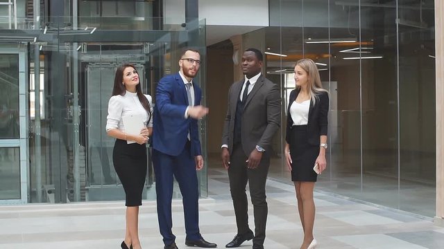 Business partners have a business meeting in a modern office building. Slow motion