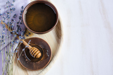 Organic honey and lavender on wooden table.