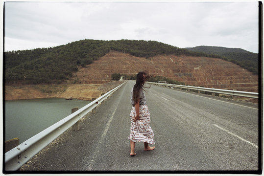 Woman on dam wall