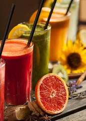 Assortment of fruit smoothies on wooden table
