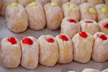 A lot of donut and strawberry jam