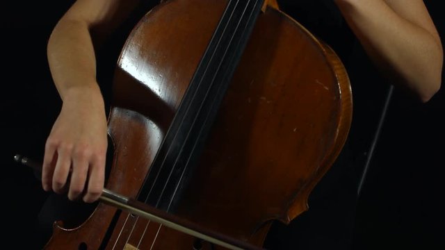 Professional cellist playing her instrument.