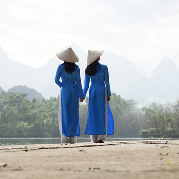 Vietnamese women in traditional costume. Vietnam