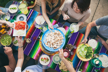 Cinco: Overhead View Of Friends Passing Food At Party