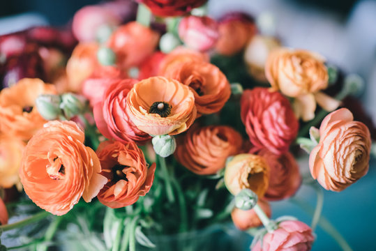 Spring flowers bouquet with orange and red ranunculus